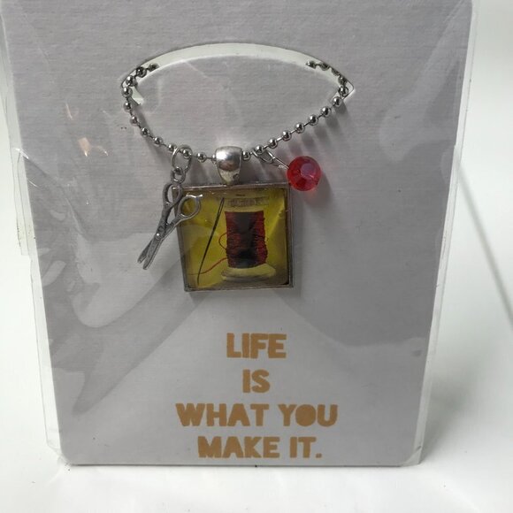 NEW Pendent necklace that has a needle and thread, 2 charms, & 22 inch chain - Picture 4 of 7